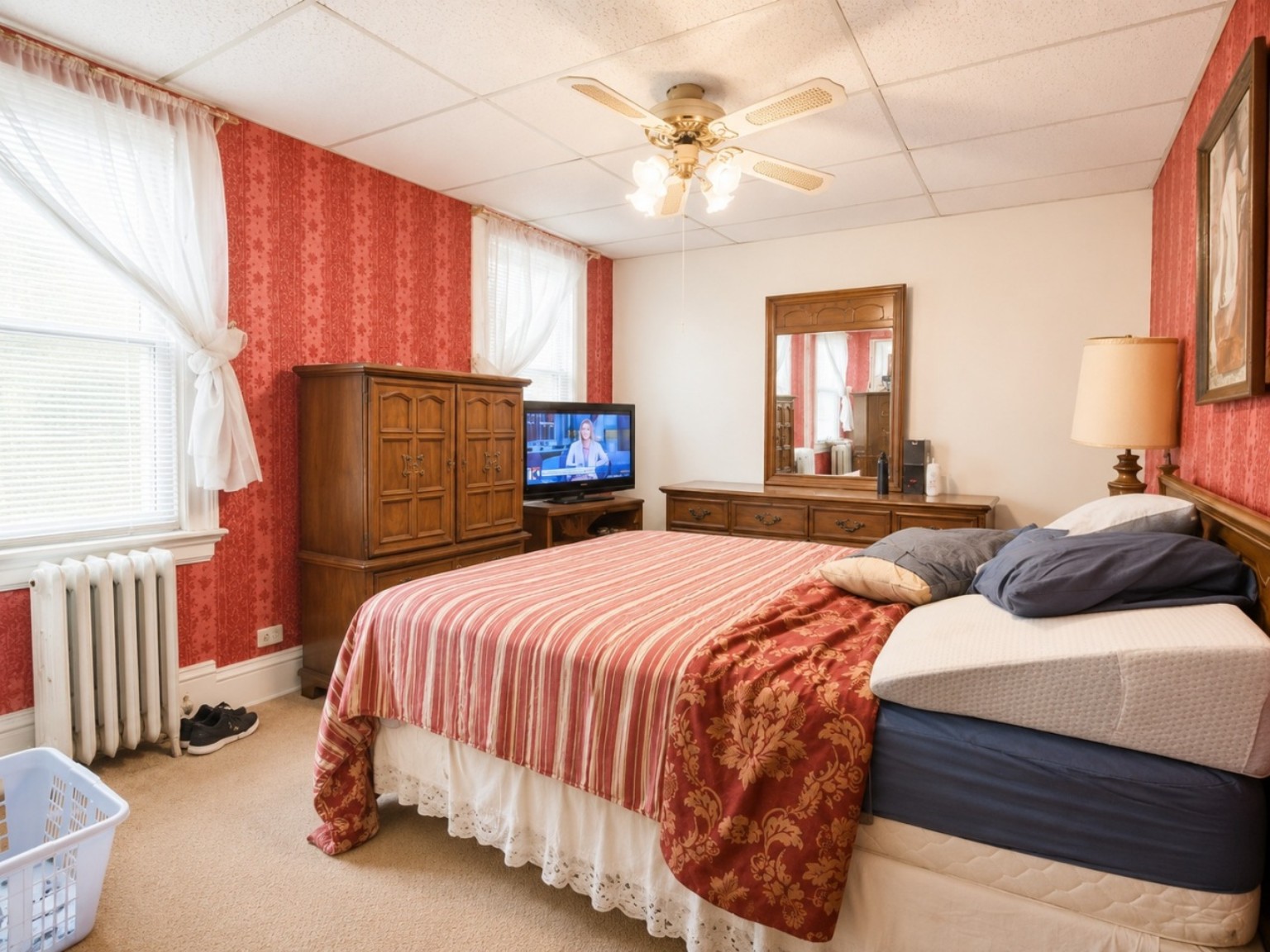 Bedroom with red accent wall