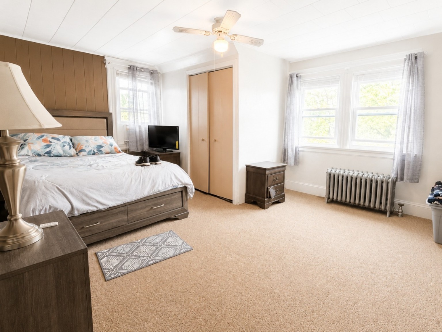 Bright bedroom with multiple windows